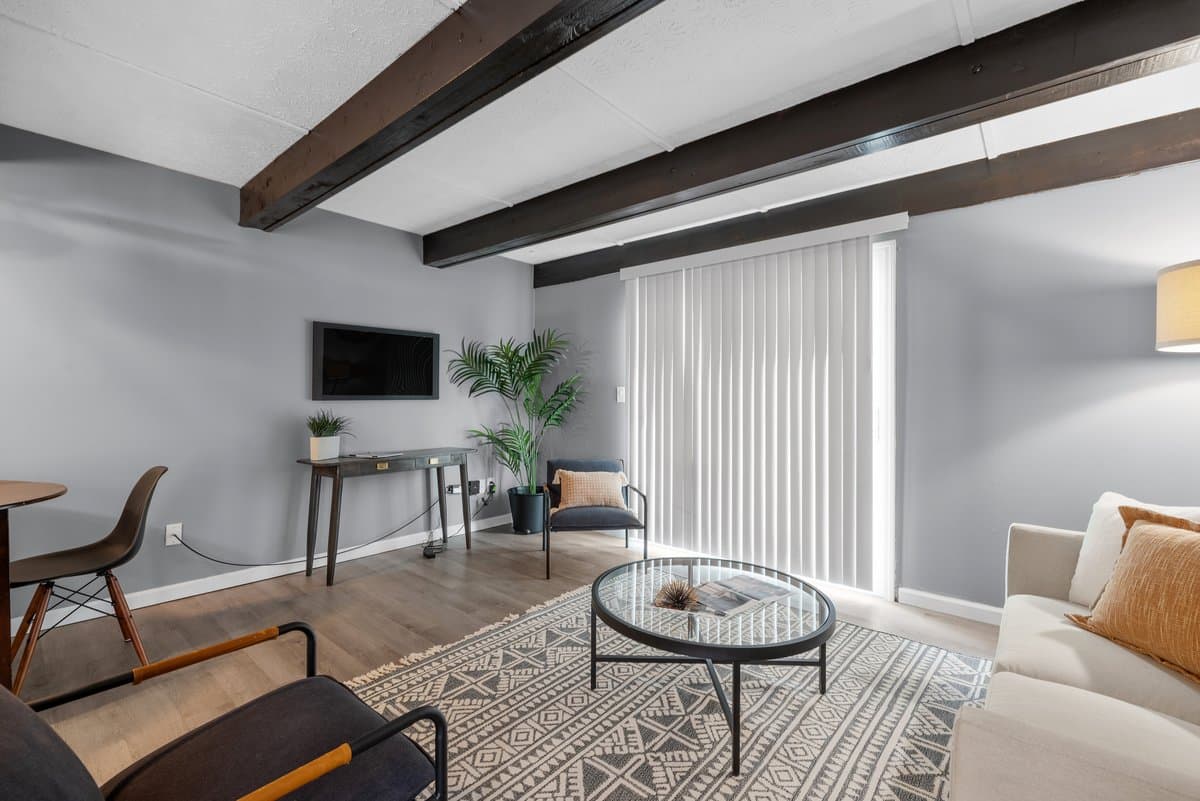 Living room with beamed ceiling